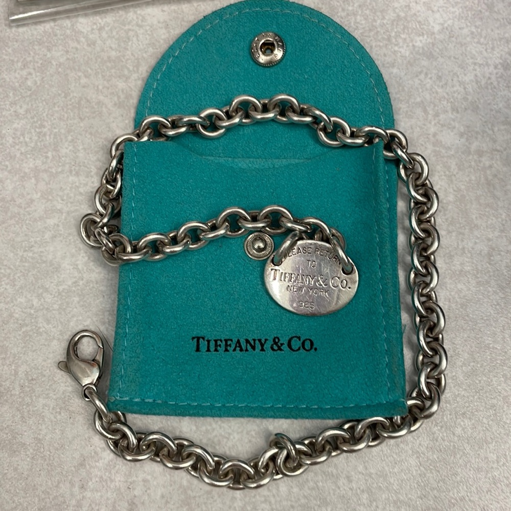 Authentic Tiffany necklace with “Please return to” on tag. With Tiffany blue bag